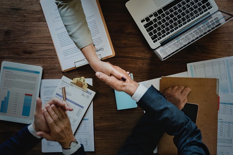 professional man and woman shaking hands